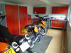 10x20ft apex garden workshop with white lined walls & hardened floor, used as a motorbike workshop, from &pound;7,650 (inc. VAT)